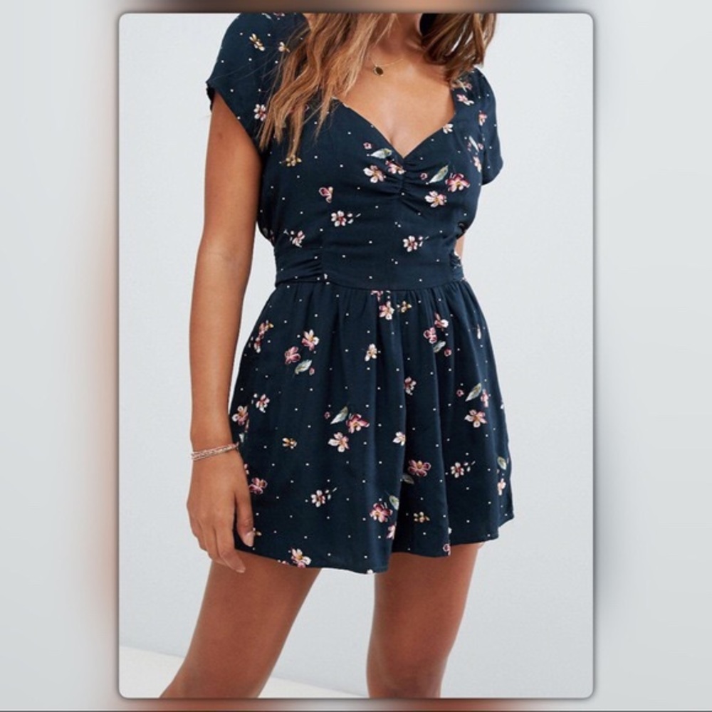 Double-lined navy floral romper with pockets